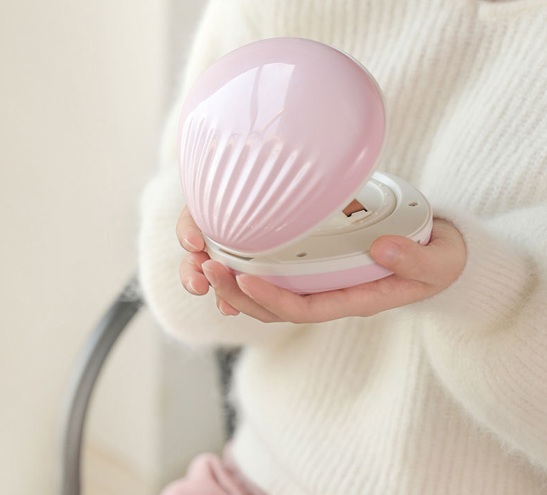 seashell-shaped LED rainbow projector light.