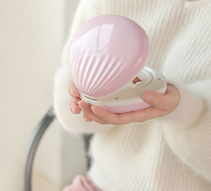 seashell-shaped LED rainbow projector light.