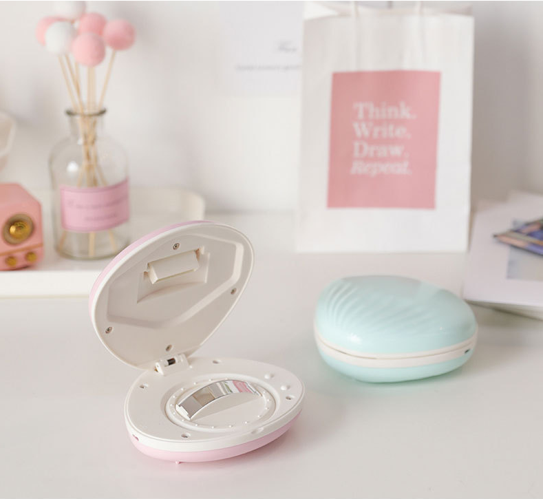seashell-shaped LED rainbow projector light.
