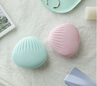 seashell-shaped LED rainbow projector light.
