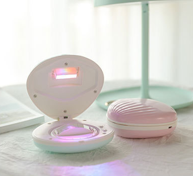 seashell-shaped LED rainbow projector light.